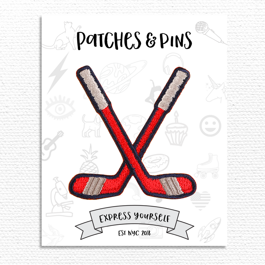 crossed field hockey sticks